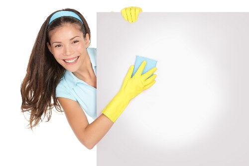 Cleaners restoring a newly built room after renovation in N4